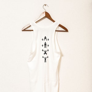 May include: White sleeveless shirt with a graphic of four stick figures lifting weights. The figures are in different poses, representing different weightlifting exercises.