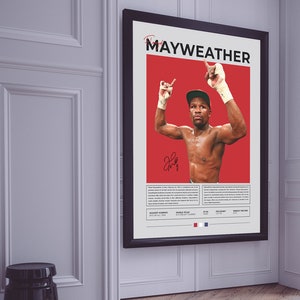 Peut inclure: Une affiche rouge et blanche avec un cadre noir repr&eacute;sentant une photo du boxeur Floyd Mayweather Jr. avec les bras lev&eacute;s en signe de victoire. L'affiche comprend le texte "Mayweather" et liste ses exploits de boxe, notamment "Highest Earning Boxer of All Time" et "World Titles in 5 Weight Classes".