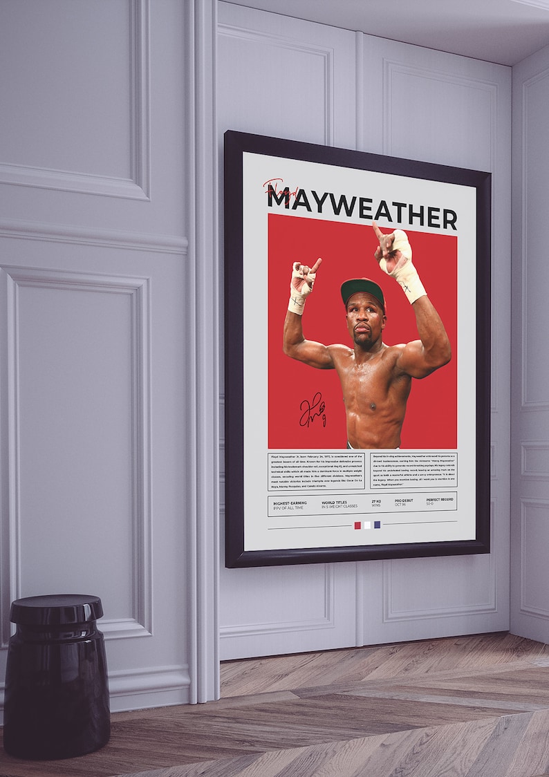 Peut inclure: Une affiche rouge et blanche avec un cadre noir repr&eacute;sentant une photo du boxeur Floyd Mayweather Jr. avec les bras lev&eacute;s en signe de victoire. L'affiche comprend le texte "Mayweather" et liste ses exploits de boxe, notamment "Highest Earning Boxer of All Time" et "World Titles in 5 Weight Classes".