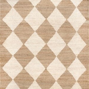 May include: A rectangular rug with a repeating diamond pattern. The design features alternating diamonds in off-white and tan, creating a textured, geometric pattern. The rug appears to be made of natural fibers.