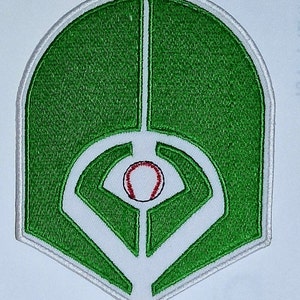 May include: Green and white embroidered patch of a baseball field with a red baseball in the center.