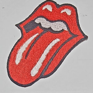 May include: Red and white embroidered tongue patch with a black outline. The tongue is sticking out and has a white stripe down the middle.