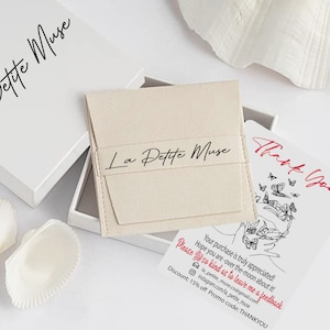 May include: A white box with the text "La Petite Muse" on it. The box is open and a small white card with the text "Thank You" and a butterfly design is visible. The card also includes the text "Your purchase is truly appreciated! Hope you are over the moon about it! Please be so kind as to leave me a feedback la_petite_muse.co@gmail.com instagram.com/la_petite_muse Discount: 15% off Promo code: THANKYOU".