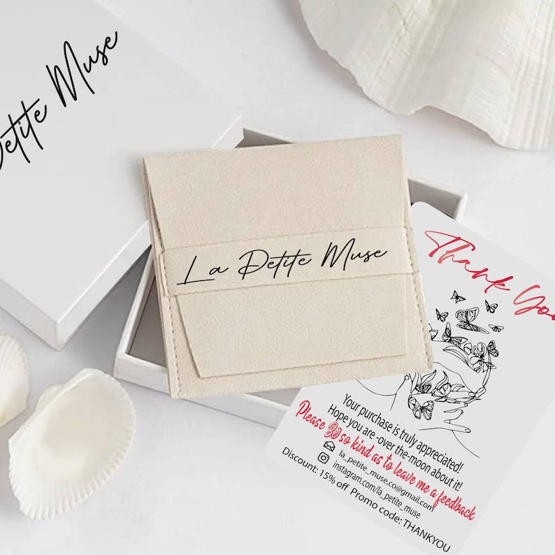 May include: A white box with the text "La Petite Muse" on it. The box is open and a small white card with the text "Thank You" and a butterfly design is visible. The card also includes the text "Your purchase is truly appreciated! Hope you are over the moon about it! Please be so kind as to leave me a feedback la_petite_muse.co@gmail.com instagram.com/la_petite_muse Discount: 15% off Promo code: THANKYOU".