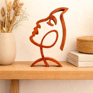 Gesicht einer Frau, minimale handgemachte Holzkunst
