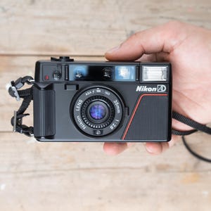 Nikon L35AD  / Nikon L35AF / 35mm f/2.8 lens /  35mm Point and Shoot Film Camera /  TESTED