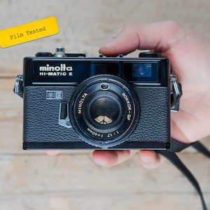 RARE Minolta Hi-Matic E / 40mm f/1.7 Rokkor Lens / Black 35mm Rangefinder Film Camera / TESTED