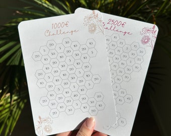 May include: Two white cards with a honeycomb pattern and numbers on each hexagon. The cards are titled "1000€ Challenge" and "2500€ Challenge".