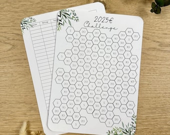 May include: A white card with a honeycomb pattern and the text "2025€ Challenge". Each hexagon contains a number, such as 5, 10, 20, or 50. The card has a green leafy design in the bottom right corner.