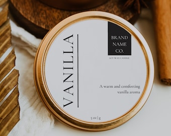 以下が含まれることがあります： ゴールドの缶に入ったキャンドルで、白いラベルには「VANILLA」と「BRAND NAME CO.」の文字が書かれています。ラベルには「温かく心地よいバニラの香り」と「5 oz / 142 g」の文字も書かれています。