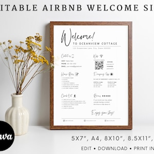 Könnte beinhalten: Editierbares, druckbares Willkommens-Schild für Airbnb-Gäste. Das Schild ist weiß mit schwarzem Text und enthält Informationen über die Unterkunft, Kontaktinformationen, Hausregeln, Check-out-Anweisungen und einen Bewertungsbereich. Das Schild ist in einem braunen Holzrahmen gerahmt.
