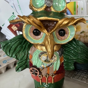 Steampunk Owl. Made with recycled materials, air dry clay, hand molded and painted.