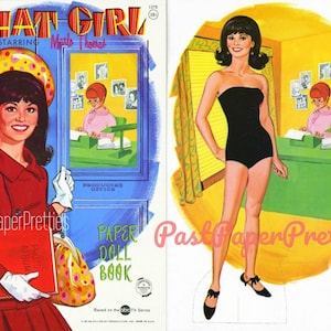 Può includere: Copertina di un libro di bambole di carta vintage con lo spettacolo "That Girl" con Marlo Thomas. L'artwork della copertina mostra una donna con un cappotto rosso e una bambola di carta della stessa donna in un costume da bagno nero. Il testo "Paper Doll Book" è visibile.