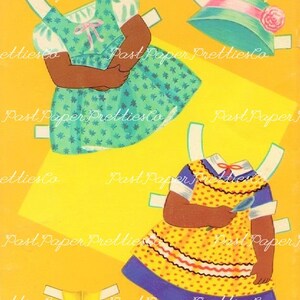 May include: Two paper dolls with black skin, one wearing a green dress with white polka dots and the other wearing a yellow dress with red and white trim and blue accents. Both dolls have white arms and legs.