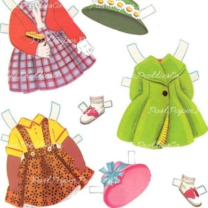 May include: A paper doll set with two dolls, one with brown skin and one with white skin. The dolls have different outfits, including a red sweater, a green coat, a yellow shirt, and a brown and orange dress. The set also includes hats and shoes.