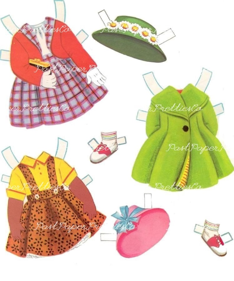 May include: A paper doll set with two dolls, one with brown skin and one with white skin. The dolls have different outfits, including a red sweater, a green coat, a yellow shirt, and a brown and orange dress. The set also includes hats and shoes.
