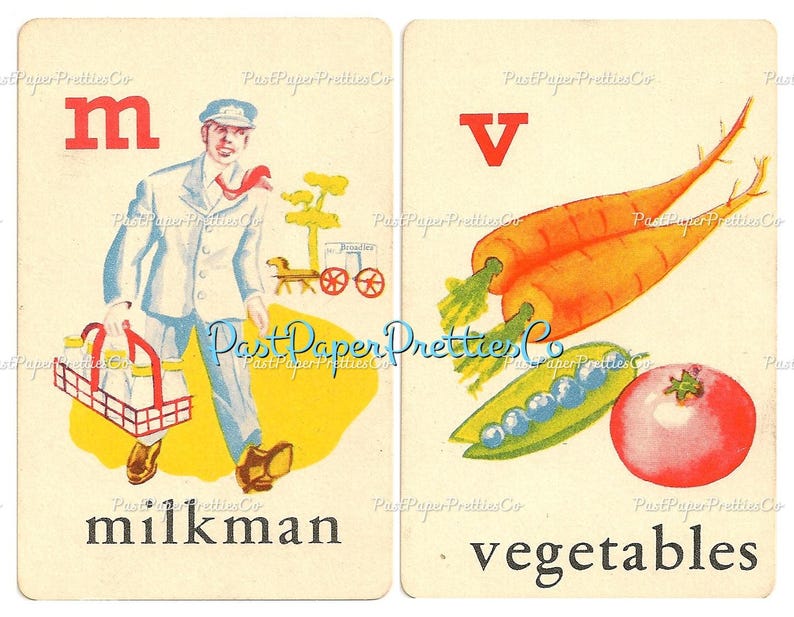 May include: Two vintage alphabet flash cards. The first card features the letter "M" in red and a cartoon milkman carrying a basket of milk bottles. The word "milkman" is printed below the image. The second card features the letter "V" in red and a cartoon image of vegetables, including carrots, peas, and a tomato. The word "vegetables" is printed below the image.