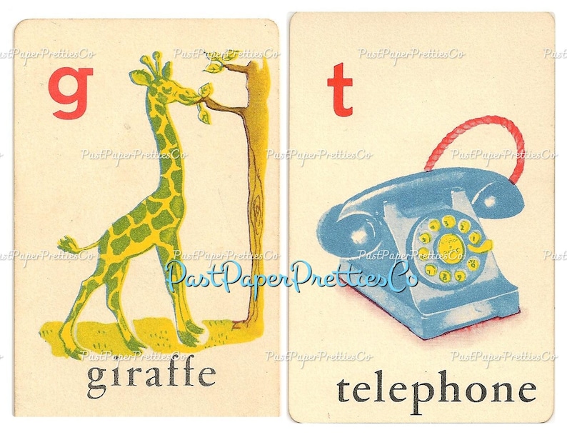 May include: Two flashcards with a letter and a picture. The first card has the letter 'g' in red and a green and yellow giraffe eating leaves from a tree. The second card has the letter 't' in red and a blue rotary phone with a red cord. The words 'giraffe' and 'telephone' are printed below the pictures.