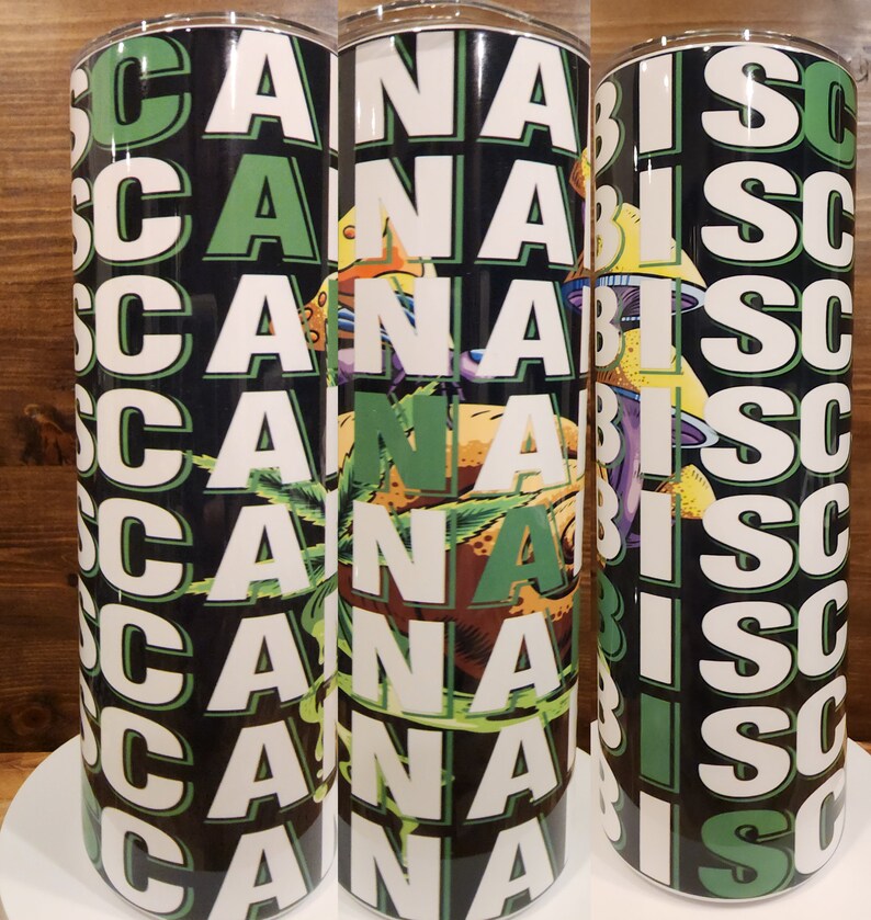 May include: Three stainless steel tumblers with a black and green design. The tumblers feature the word "Cannabis" repeated multiple times in white letters.