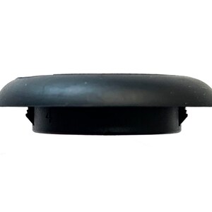 May include: A black, circular rubber stopper with a rounded top and a cylindrical base. The base has the number "4" imprinted on it. The stopper is designed to fit snugly into a corresponding opening.