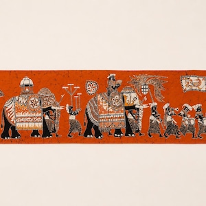 May include: A rectangular fabric wall hanging featuring a vibrant orange background with a detailed batik-style illustration of a ceremonial procession. The scene depicts two elephants adorned in patterned caparisons, accompanied by figures carrying umbrellas, flags, and musical instruments, with a stylised sun in the upper right corner.
