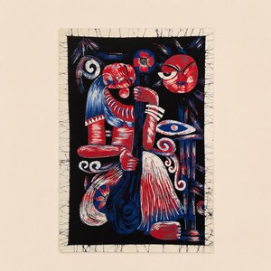 May include: Abstract art print featuring a stylized figure in red, blue, and white against a black background. The artwork has a tribal or folk art aesthetic, with bold shapes and patterns. The print is framed with a white border.