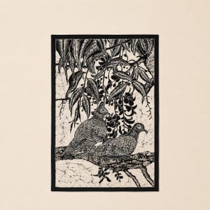 May include: Black and white illustration of two doves perched on a branch, under a canopy of leaves and hanging flowers. The artwork is framed with a black border and set against a cream-colored background.