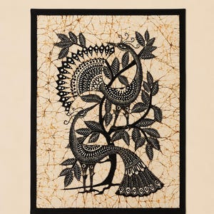 May include: Black and white batik art print featuring two stylized birds perched in a tree. The birds have detailed patterns and long tails. The background is a light beige with a crackle effect, framed by a black border.