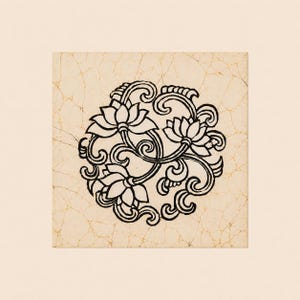 May include: A square tile featuring a central black ink illustration of three stylized lotus flowers surrounded by swirling vine patterns. The background is a light beige color with a fine, dark brown crackle texture throughout the surface.