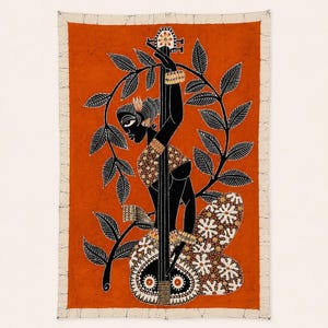 May include: A rectangular batik wall hanging featuring a burnt orange background with a black silhouette of a figure playing a stringed instrument. The figure is framed by black leafy branches and wears patterned clothing with white floral motifs.