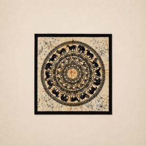 May include: A square textile wall hanging featuring a circular batik design in black on a cream-colored background. The pattern consists of concentric rings filled with intricate silhouettes of elephants and other animals, framed by a black border.