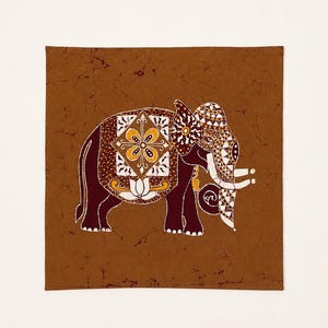 May include: A square fabric piece featuring a dark brown elephant silhouette on a medium brown background. The elephant is decorated with intricate white, yellow, and brown geometric patterns, including a floral motif on its side and ornate ear details.