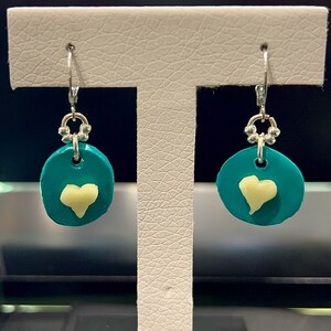 Round brilliant sterling silver earrings