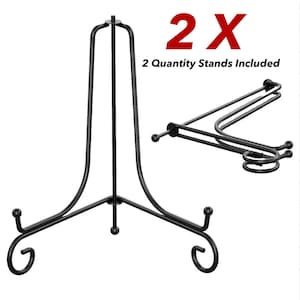 May include: Black metal display stands. The stands have a tripod base with decorative scrollwork and a curved top. The image includes the text "2X" and "2 Quantity Stands Included".