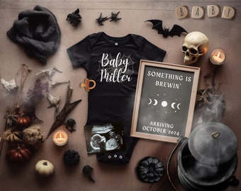May include: A Halloween-themed baby announcement with a black onesie that says "Baby Miller" and a chalkboard sign that says "Something is Brewin' Arriving October 2024".