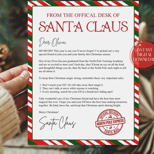 May include: A Christmas-themed letter from Santa Claus, with a red and green border design. The letter is addressed to "Olivia" and includes the text "From the Official Desk of Santa Claus." A red circle indicates "Instant Digital Download."