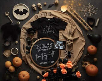 May include: A Halloween-themed baby announcement featuring a black onesie with "Baby Williams" printed on it. The announcement includes a letter board with the text "Trick or Treat? Our family is growing by two tiny feet, February 2024". Decorative pumpkins, skulls, and flowers surround the announcement.