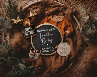 May include: A brown wicker basket filled with a brown blanket, a stuffed reindeer holding an ultrasound image, a pair of brown baby shoes, a black letter board with the text "Daddy's New Hunting Buddy Arriving April 2024", and a wooden round sign with the text "Baby Miller".