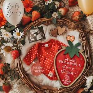 May include: A wooden strawberry-shaped sign with the text "We have been keeping a Berry big secret! October 2024". The sign is surrounded by strawberries, a baby onesie, a white balloon with the text "Baby Berry", and a sonogram photo.