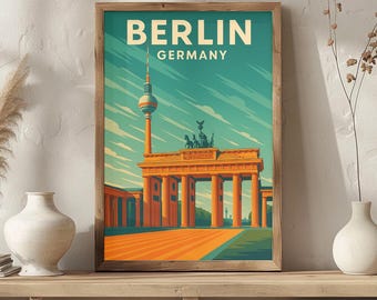 May include: A framed art print featuring a vintage travel poster design for Berlin, Germany. The poster showcases the Brandenburg Gate, a tall TV tower, and the text "BERLIN GERMANY" in a retro style. The color palette includes shades of orange, teal, and beige.