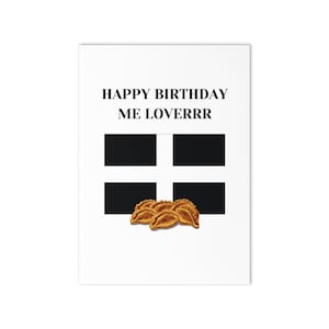 May include: A white greeting card with the text "HAPPY BIRTHDAY ME LOVERRR" in black. The card features a black and white cross design and a cluster of golden-brown pastries.