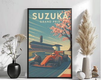May include: Framed art print featuring a vintage-style illustration of the Suzuka Grand Prix. The artwork showcases a red race car on a track, with the text "SUZUKA GRAND PRIX" at the top. The background includes a building, cherry blossom tree, and a blue sky.