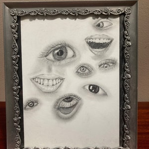 Framed Drawing Of Eyes And Mouths