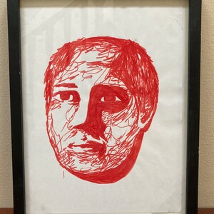 Framed Red Marker Portrait Drawing Of A Man