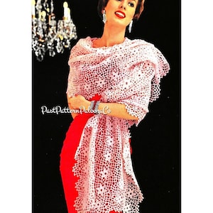 May include: A pink crocheted shawl with a floral pattern. The shawl is draped over a woman wearing a red dress.
