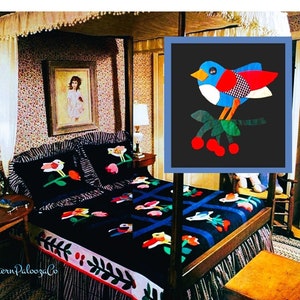 May include: A black and white quilt with a colorful bird and cherry design. The quilt is on a bed with a canopy and a floral patterned wallpaper. The quilt is made with different fabrics and textures. The quilt is a vintage design and is a great example of patchwork quilting.