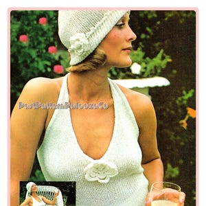 May include: A vintage knitting pattern for a white halter top with a crocheted flower detail. The pattern includes instructions for a matching white crocheted hat.