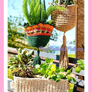 May include: Two crocheted hanging plant baskets and one rectangular crocheted planter. One basket is dark green with an orange and pink floral-patterned rim and a tassel. The other is tan with a long tassel. The rectangular planter is cream.