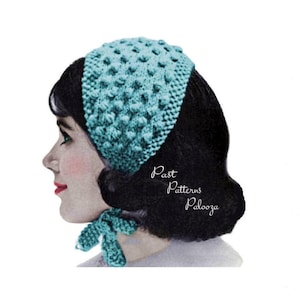 May include: A teal blue knitted headband with a textured pattern. The headband is worn by a woman with dark hair. The text "Past Patterns Palooza" is visible in the image.