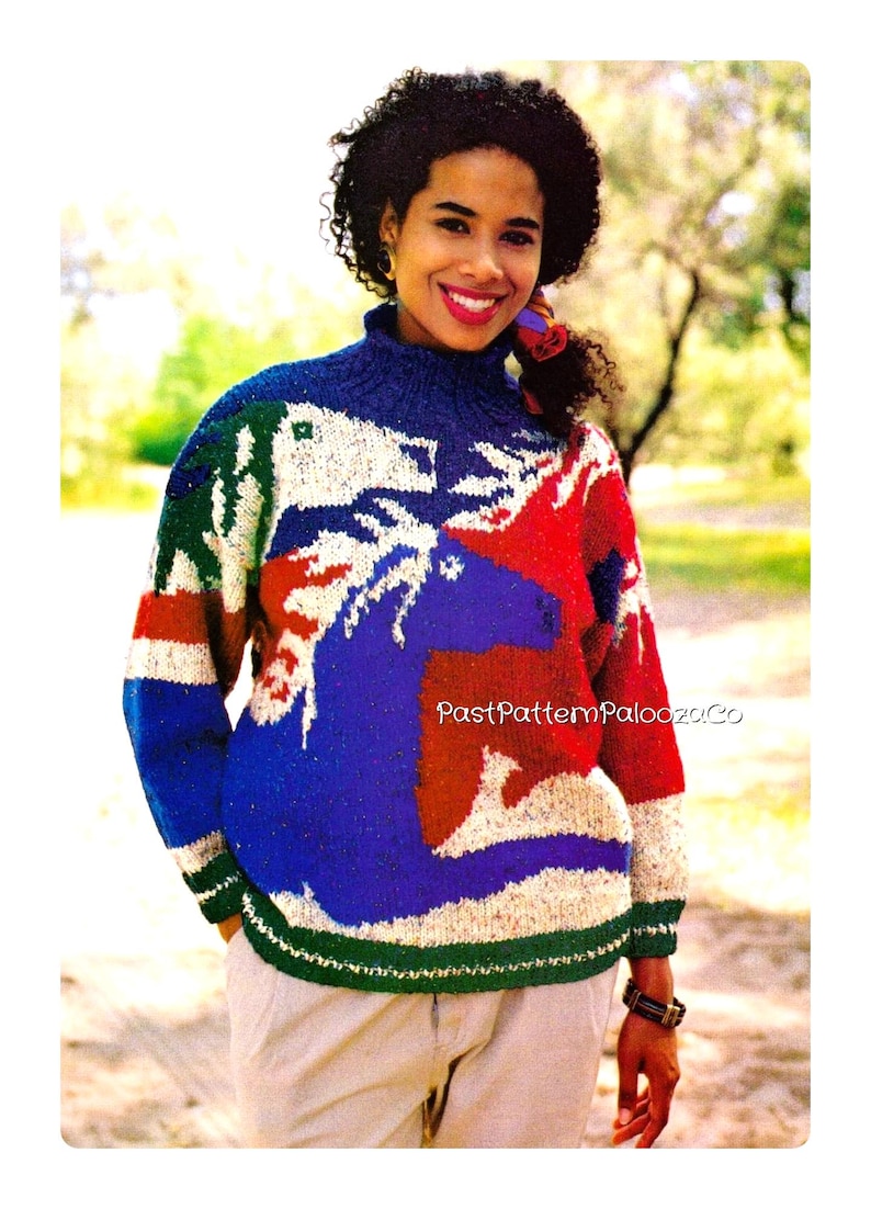 May include: A long-sleeved knit sweater featuring a high collar and a multi-colored intarsia pattern of horses in blue, red, white, and green. The text PastPatternPalooza.Co is printed in white across the center of the sweater.